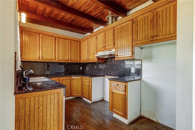 4523 Columbia Ave, Riverside, CA 92501 - kitchen featuring under cabinet range hood, a wood ceiling with exposed beams, decorative backsplash, dark wood-style floors, and dark stone counters