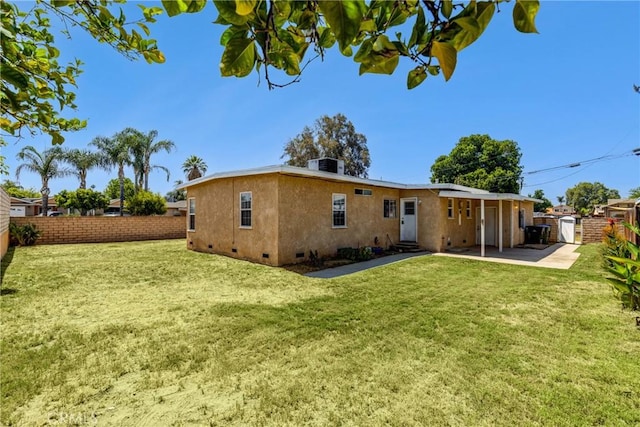 4523 Columbia Ave, Riverside, CA 92501 - rear view of house featuring crawl space, a fenced backyard, and a patio area