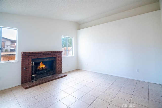 9018 Buckthorn Ave, Hesperia, CA 92345 - unfurnished living room featuring a fireplace, a textured ceiling, light tile patterned flooring, and lofted ceiling