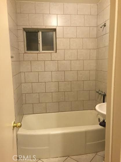 45040 Redwood Ave, Lancaster, CA 93534 - full bathroom with tile patterned flooring and shower / bath combination