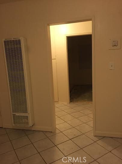 45040 Redwood Ave, Lancaster, CA 93534 - corridor with a heating unit and light tile patterned floors
