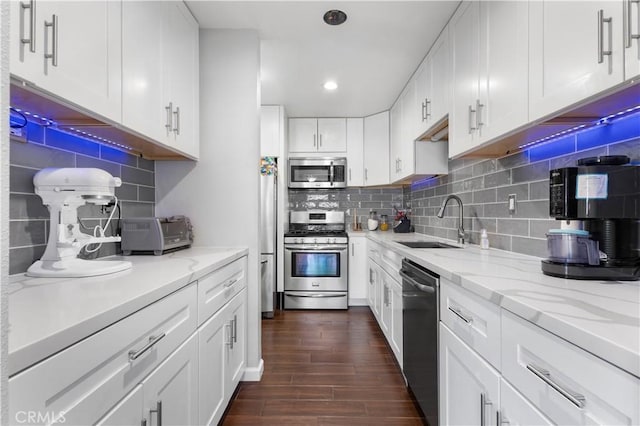 31319 The Old Rd Unit A, Castaic, CA 91384 - kitchen featuring stainless steel appliances, decorative backsplash, dark wood-type flooring, white cabinets, and recessed lighting