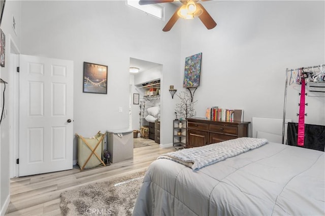 31319 The Old Rd Unit A, Castaic, CA 91384 - bedroom with a high ceiling, wood finished floors, a walk in closet, a closet, and a ceiling fan