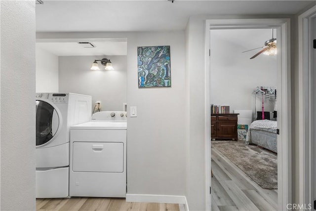 31319 The Old Rd Unit A, Castaic, CA 91384 - washroom featuring independent washer and dryer, light wood-type flooring, and a ceiling fan