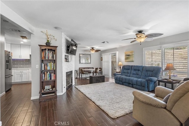 31319 The Old Rd Unit A, Castaic, CA 91384 - living area with a ceiling fan, dark wood-type flooring, and a fireplace