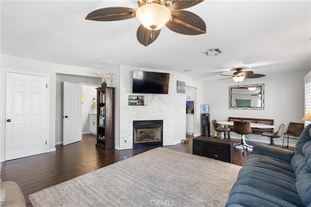 31319 The Old Rd Unit A, Castaic, CA 91384 - living area with a ceiling fan, dark wood finished floors, and a stone fireplace