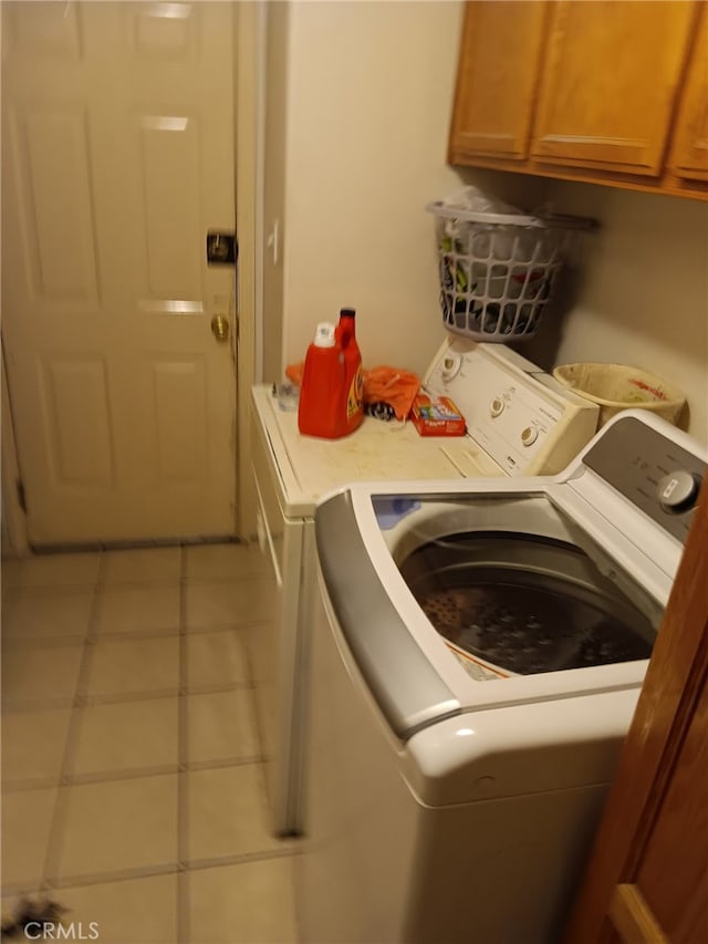 412 Leeta St, Bakersfield, CA 93307 - laundry area with independent washer and dryer, cabinet space, and tile patterned flooring