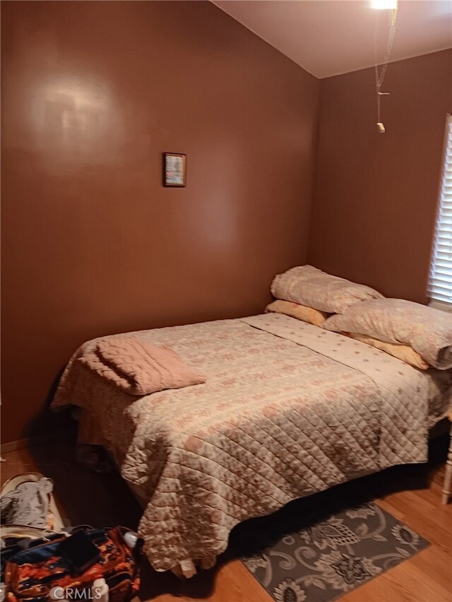 412 Leeta St, Bakersfield, CA 93307 - bedroom with wood finished floors and lofted ceiling