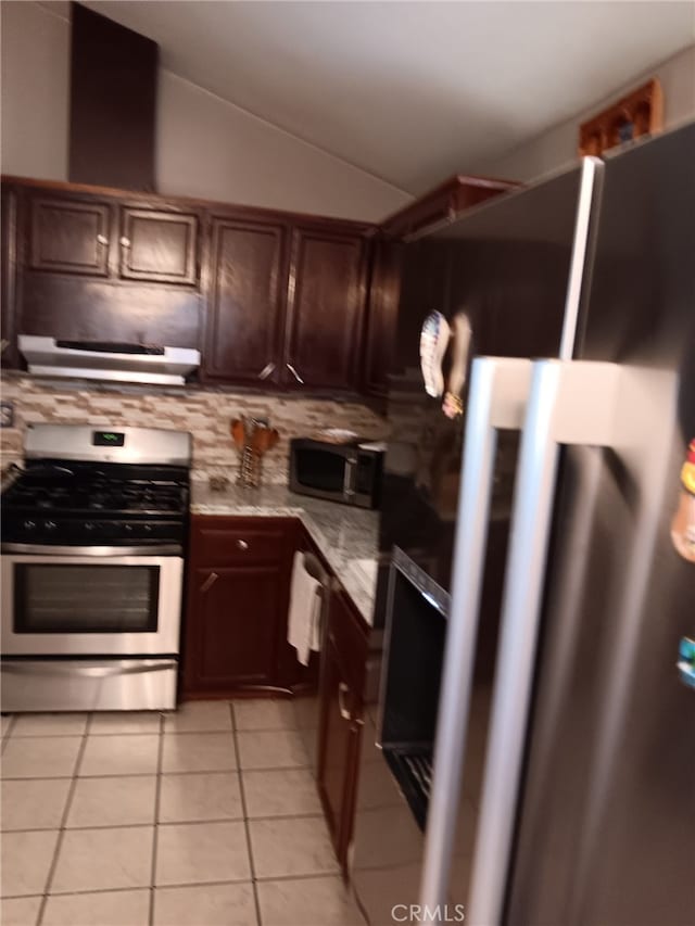 412 Leeta St, Bakersfield, CA 93307 - kitchen with appliances with stainless steel finishes, light tile patterned flooring, ventilation hood, decorative backsplash, and lofted ceiling