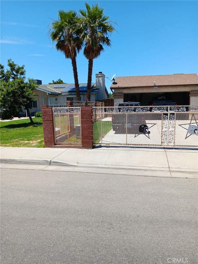 412 Leeta St, Bakersfield, CA 93307 - view of front facade featuring a gate