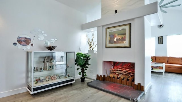 10361 Perdido St, Anaheim, CA 92804 - living room featuring wood finished floors, a towering ceiling, and ceiling fan