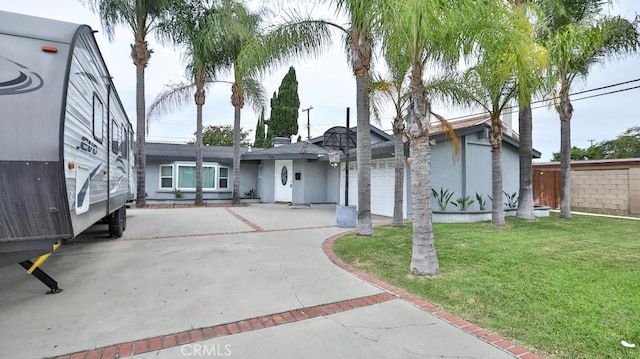 10361 Perdido St, Anaheim, CA 92804 - view of front of house featuring driveway and a front lawn