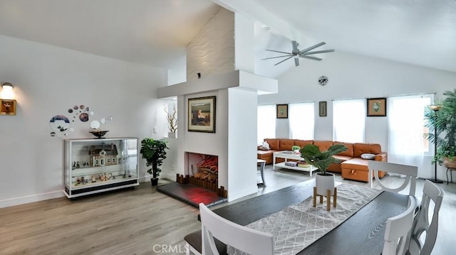 10361 Perdido St, Anaheim, CA 92804 - living room featuring a ceiling fan, light wood-style floors, and high vaulted ceiling