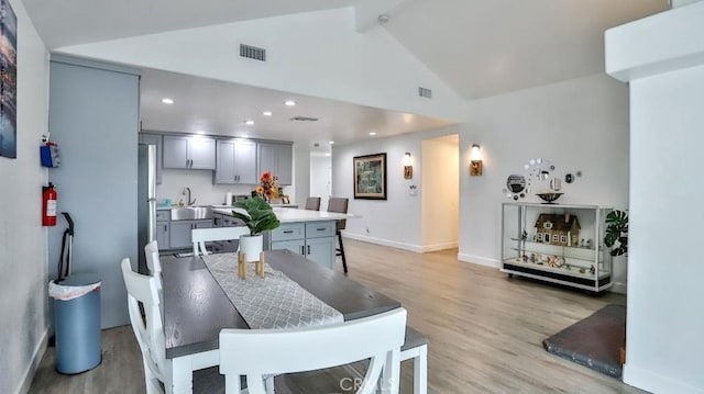 10361 Perdido St, Anaheim, CA 92804 - dining area with light wood finished floors, recessed lighting, and high vaulted ceiling