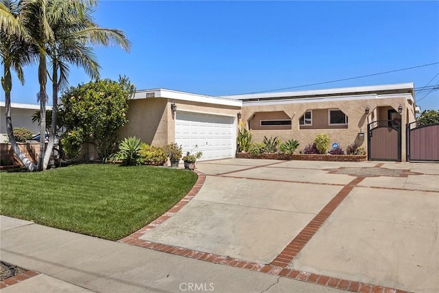 15503 Fernview St, Whittier, CA 90604 - single story home with stucco siding, a gate, a front yard, driveway, and a garage