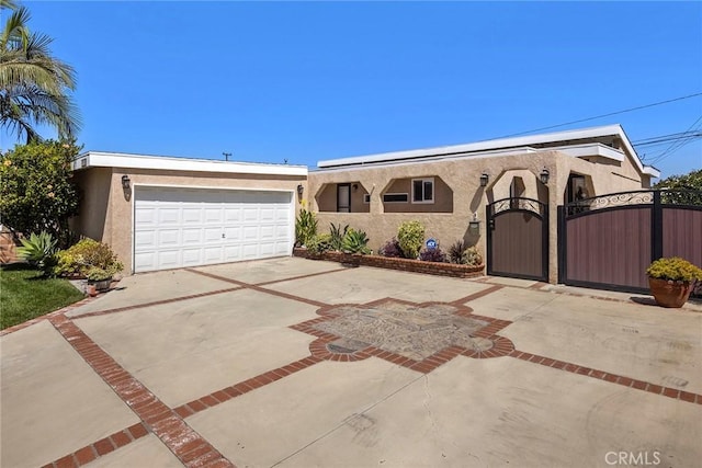 15503 Fernview St, Whittier, CA 90604 - view of front facade featuring stucco siding, a gate, and driveway