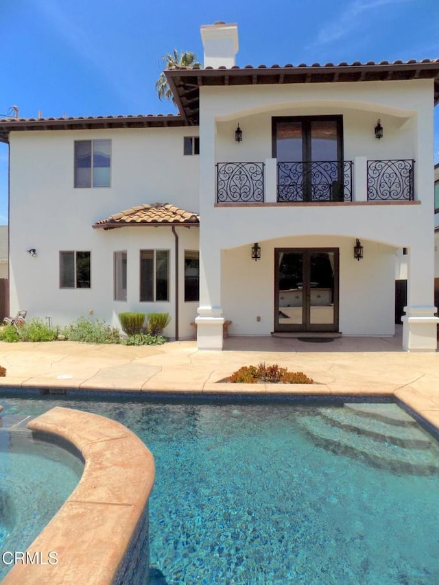 4526 Katherine Ave, Sherman Oaks, CA 91423 - rear view of house featuring a balcony, a patio area, a tiled roof, stucco siding, and a chimney