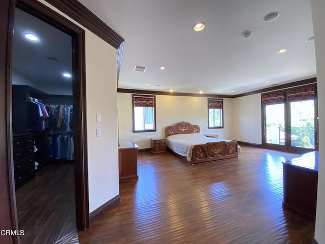 4526 Katherine Ave, Sherman Oaks, CA 91423 - bedroom with crown molding, dark wood finished floors, a spacious closet, and recessed lighting