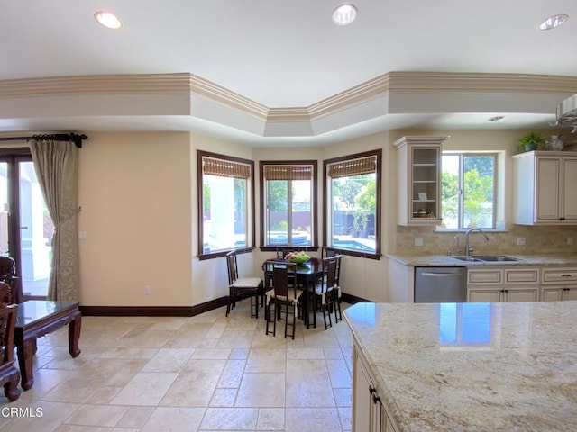 4526 Katherine Ave, Sherman Oaks, CA 91423 - kitchen with stainless steel dishwasher, light stone countertops, backsplash, recessed lighting, and cream cabinetry