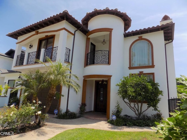 4526 Katherine Ave, Sherman Oaks, CA 91423 - mediterranean / spanish home with a balcony, stucco siding, and a tiled roof