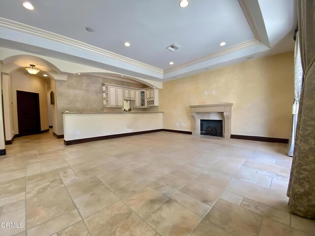 4526 Katherine Ave, Sherman Oaks, CA 91423 - unfurnished living room with arched walkways, crown molding, a tray ceiling, a fireplace, and recessed lighting