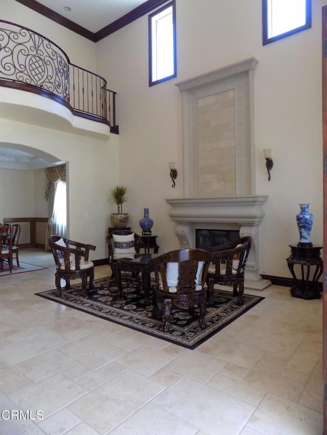 4526 Katherine Ave, Sherman Oaks, CA 91423 - dining area featuring a high ceiling, arched walkways, healthy amount of natural light, a fireplace, and ornamental molding