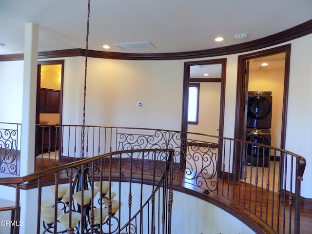 4526 Katherine Ave, Sherman Oaks, CA 91423 - stairs with stacked washing machine and dryer, crown molding, and recessed lighting