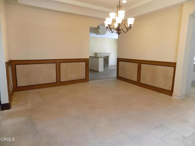 4526 Katherine Ave, Sherman Oaks, CA 91423 - unfurnished room featuring a raised ceiling and a chandelier