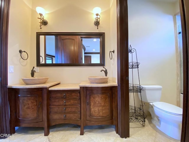 4526 Katherine Ave, Sherman Oaks, CA 91423 - bathroom featuring double vanity and tile patterned flooring