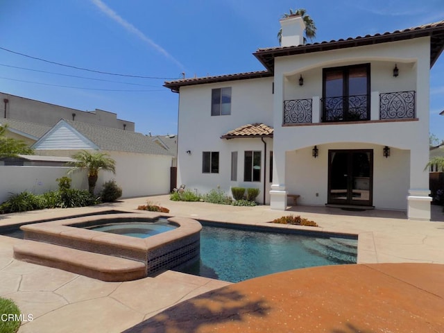4526 Katherine Ave, Sherman Oaks, CA 91423 - rear view of house with a balcony, stucco siding, a chimney, a tiled roof, and a patio area