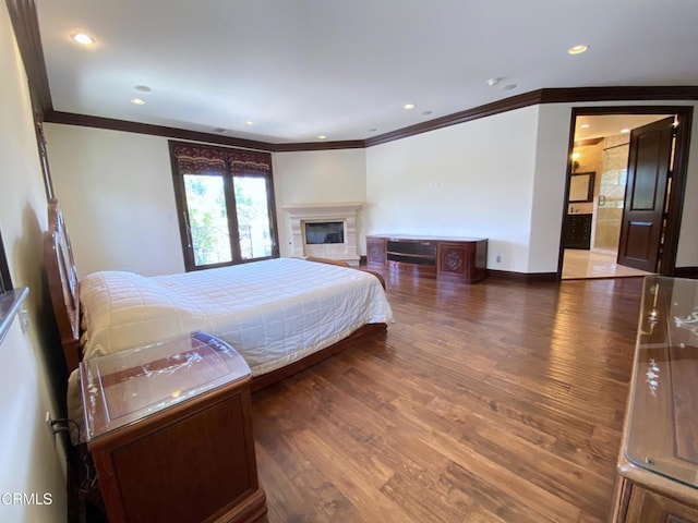 4526 Katherine Ave, Sherman Oaks, CA 91423 - bedroom featuring ornamental molding, wood finished floors, a glass covered fireplace, and recessed lighting