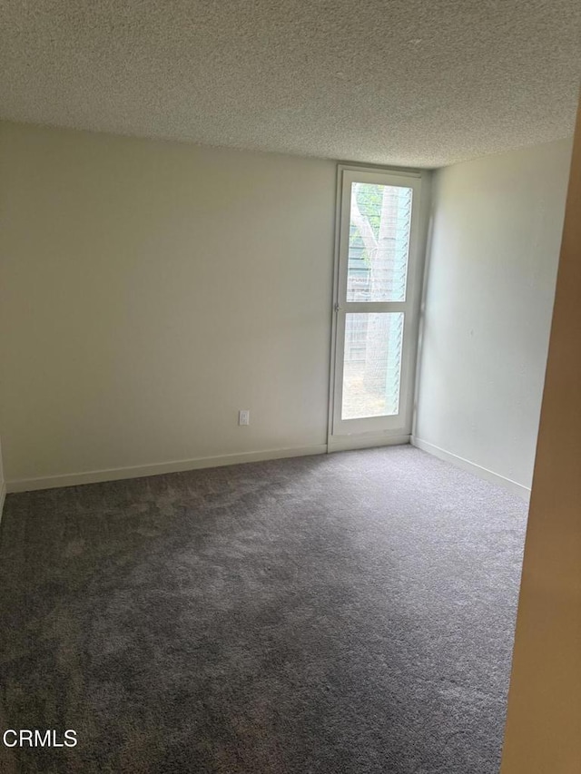 3700 Dean Dr Unit 1301, Ventura, CA 93003 - carpeted empty room featuring a textured ceiling
