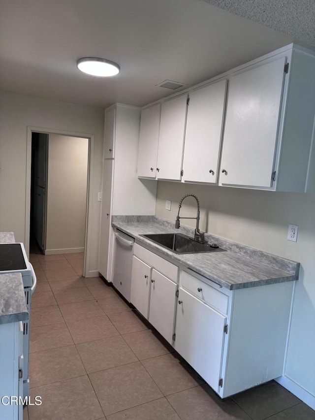 3700 Dean Dr Unit 1301, Ventura, CA 93003 - kitchen with dishwasher, stove, white cabinets, and light tile patterned floors
