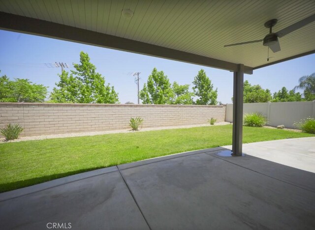 25382 Rocking Horse Ct, Menifee, CA 92584 - fenced backyard featuring a ceiling fan and a patio area