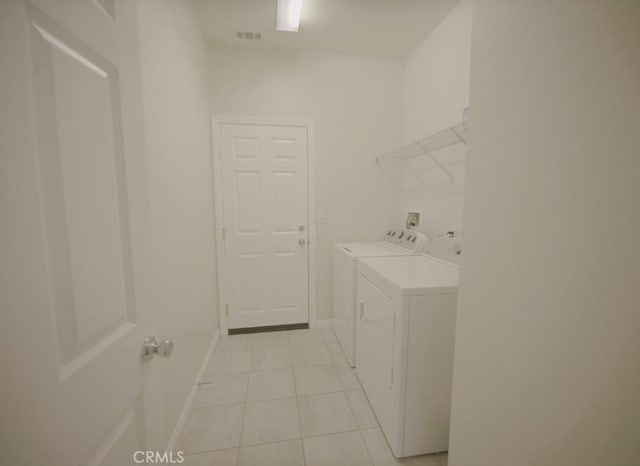 25382 Rocking Horse Ct, Menifee, CA 92584 - washroom with independent washer and dryer and light tile patterned floors