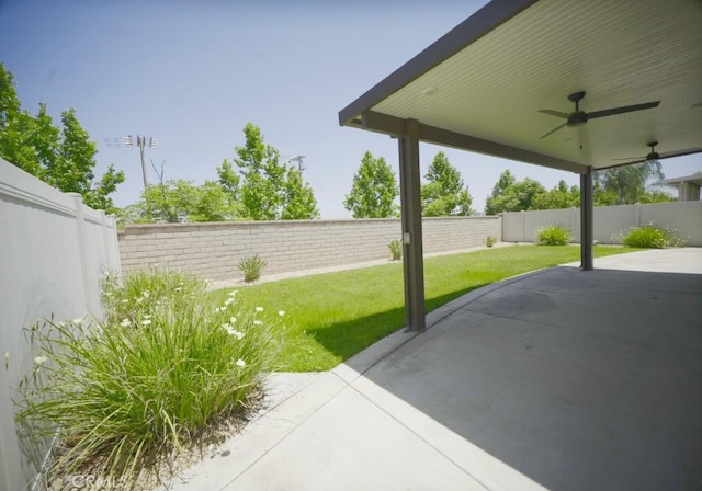 25382 Rocking Horse Ct, Menifee, CA 92584 - fenced backyard with ceiling fan and a patio area