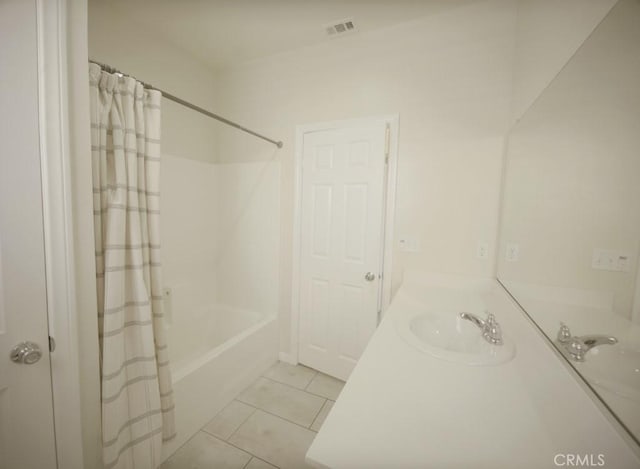 25382 Rocking Horse Ct, Menifee, CA 92584 - bathroom featuring tile patterned floors, shower / bath combo with shower curtain, and vanity