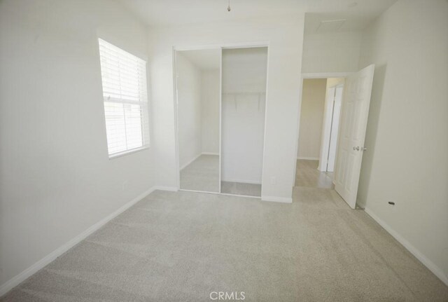 25382 Rocking Horse Ct, Menifee, CA 92584 - unfurnished bedroom featuring light carpet and a closet