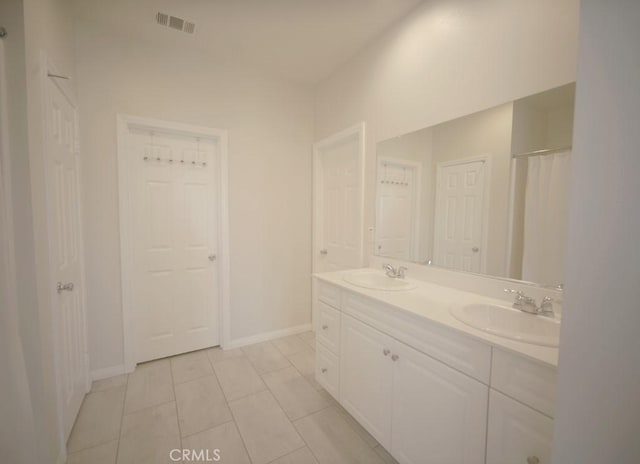 25382 Rocking Horse Ct, Menifee, CA 92584 - bathroom featuring double vanity and tile patterned flooring