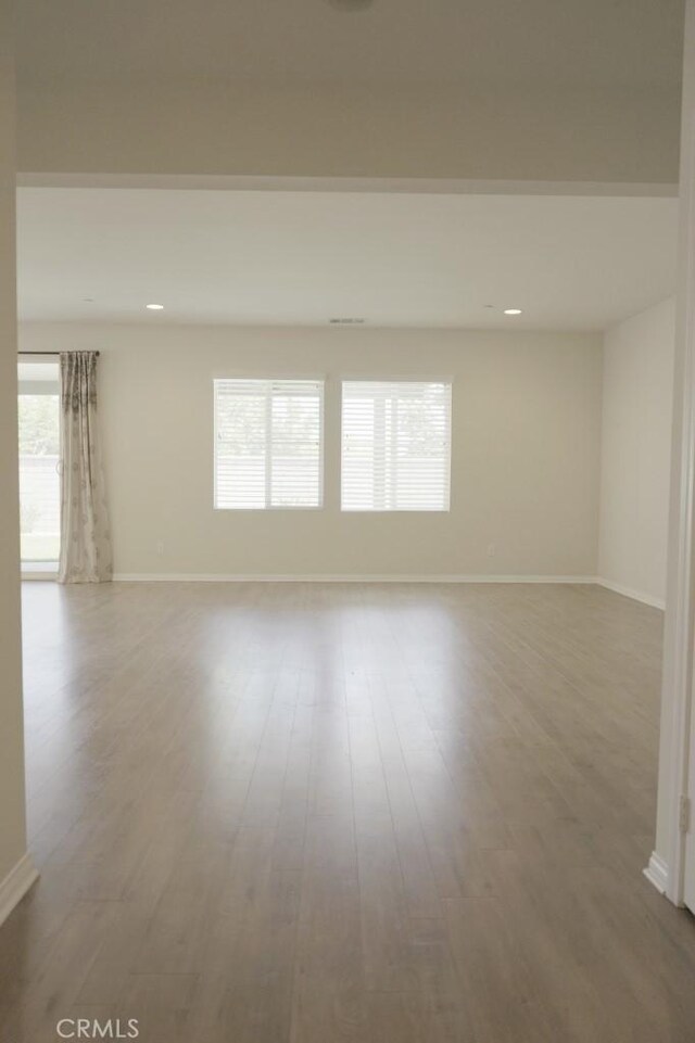 25382 Rocking Horse Ct, Menifee, CA 92584 - unfurnished room with wood finished floors and recessed lighting