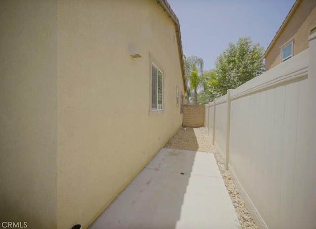 25382 Rocking Horse Ct, Menifee, CA 92584 - view of property exterior with stucco siding and a patio area