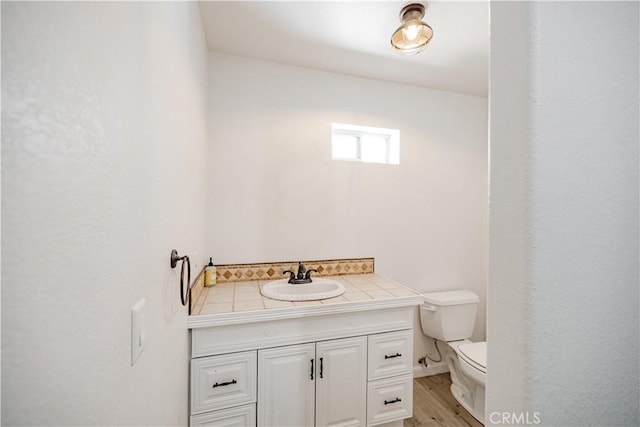 3807 Paula Ln, Lancaster, CA 93535 - half bath with vanity and wood finished floors