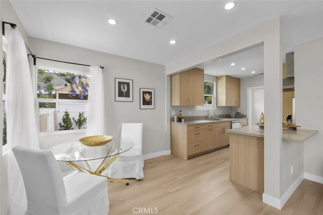 6820 Jellico Ave, Van Nuys, CA 91406 - kitchen featuring light brown cabinets, light wood-style flooring, light countertops, recessed lighting, and modern cabinets