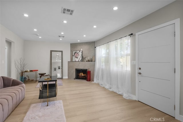 6820 Jellico Ave, Van Nuys, CA 91406 - living area with recessed lighting, a fireplace, and light wood-style floors