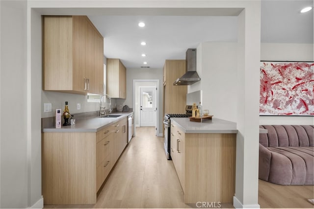 6820 Jellico Ave, Van Nuys, CA 91406 - kitchen featuring wall chimney exhaust hood, light brown cabinets, stainless steel range with gas stovetop, light wood-type flooring, and modern cabinets