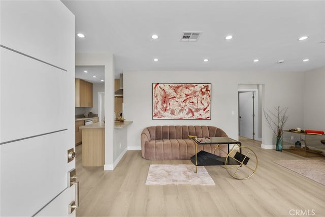 6820 Jellico Ave, Van Nuys, CA 91406 - living area featuring light wood finished floors and recessed lighting