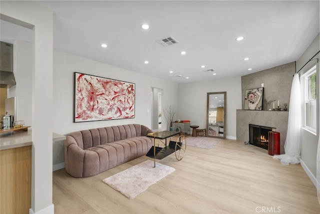 6820 Jellico Ave, Van Nuys, CA 91406 - living area with light wood-style floors, recessed lighting, and a fireplace