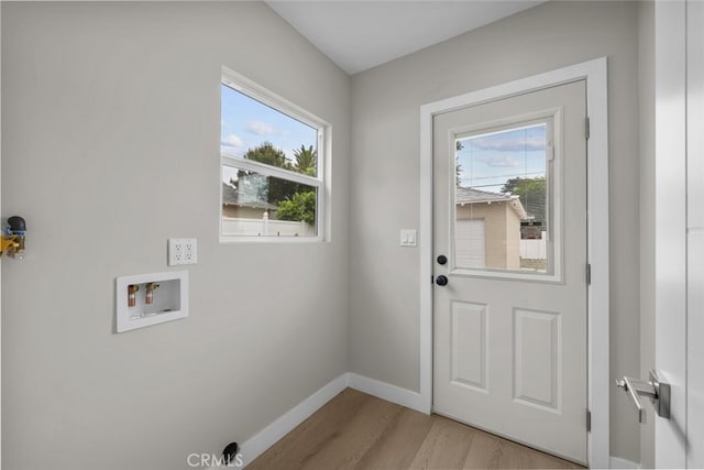 6820 Jellico Ave, Van Nuys, CA 91406 - laundry area featuring plenty of natural light, washer hookup, and light wood-style flooring