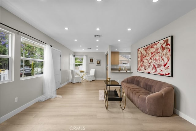 6820 Jellico Ave, Van Nuys, CA 91406 - living area featuring light wood-style flooring and recessed lighting