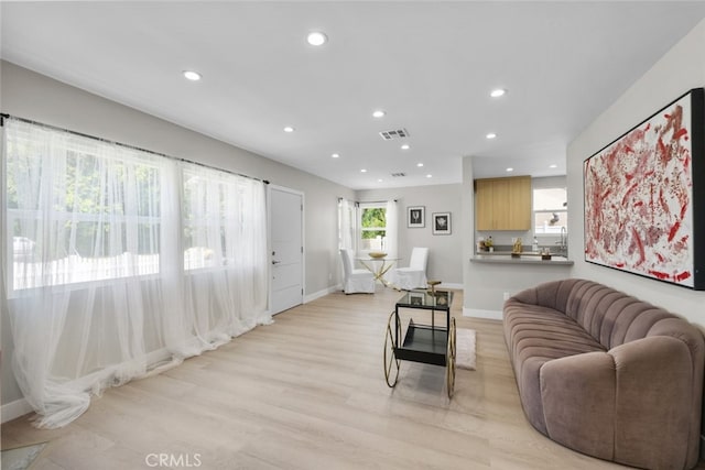 6820 Jellico Ave, Van Nuys, CA 91406 - living area featuring light wood finished floors and recessed lighting